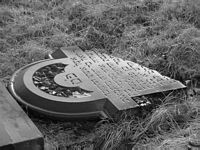 Jewish gravestone,shattered by bigoted pricks