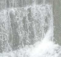Image taken of water through a canal lock-gate
